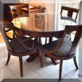 F07. Ethan Allen round dining table with 4 chairs. (Includes a leaf) 